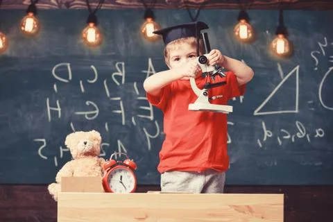 Smart kid concept. First former interested in studying, learning, education Stock Photos