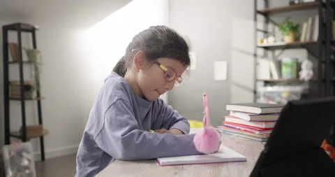 Smart kid girl learning online, watching remote learning class, talking with Stock Footage 268052252