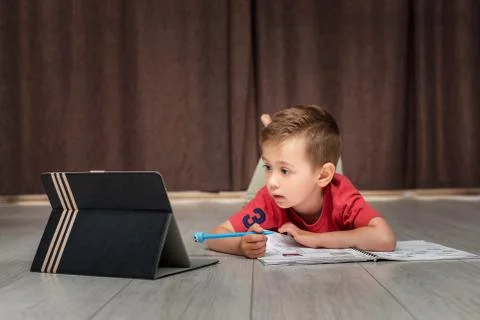 A smart kid learns remotely Stock Photos