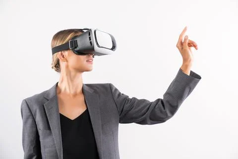 Smart leader touching at program or working while using VR glasses. Contraption. Foto stock