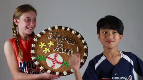 A smart little boy dances and a cute girl holds a wooden frame with him Stock Footage 22734962