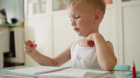Smart little boy learning how to write. Education for children. Happy small.. Video stock 335686946