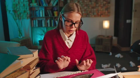 Smart looking lady with a pretty face in front of the camera using old Stock Footage 135594954