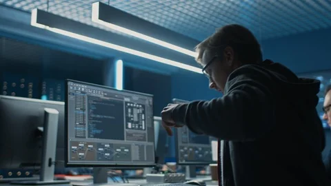 Smart Male IT Programer Stretches and Warms up Hands Before Starting Working on Stock Footage 103270492