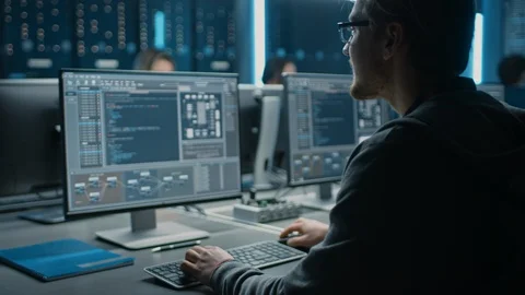 Smart Male IT Programer Working on Desktop Computer in Data Center Technical Stock Footage 103270691