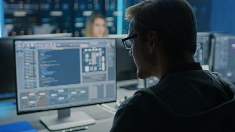 Smart Male IT Programer Working on Desktop Computer in Data Center Technical Sys Stock Footage 103270776