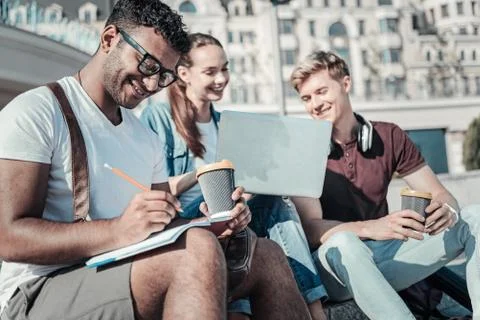 Smart male student taking notes Stock Photos