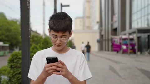 Smart male tourist using navigation app to find exact address outdoors Stock Footage 333640980