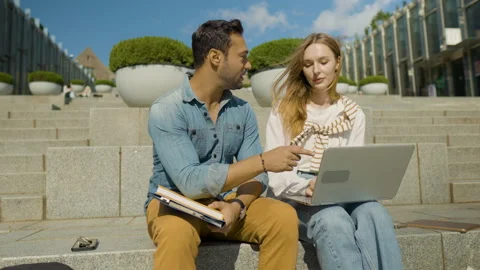 Smart Man Collage Student Helping Girl Classmate With School Homework Stock Footage 219407153