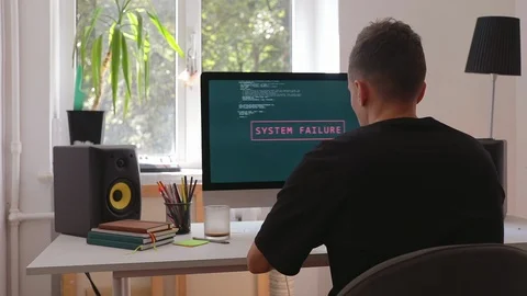 Smart man programmer working at home in loft room writing programming code for Stock Footage 115491729