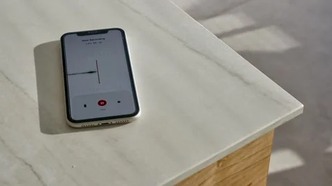 Smart mobile phone on kitchen counter recording conversation with voice notes Stock Footage 314891489