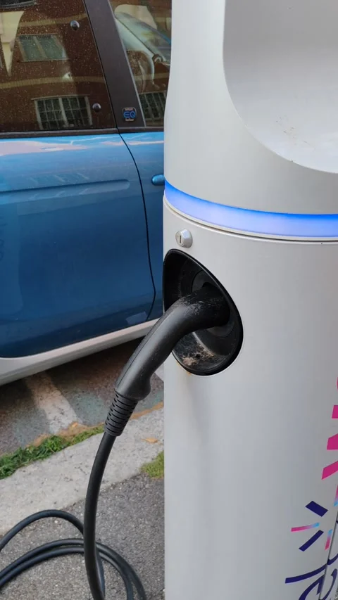 A Smart model small car, parked for electric charging 스톡 동영상 277579583