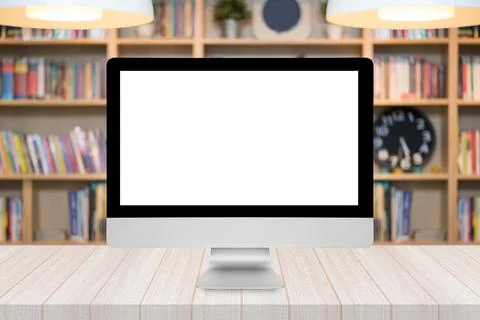 Smart modern PC with white blank screen on wooden table Photos
