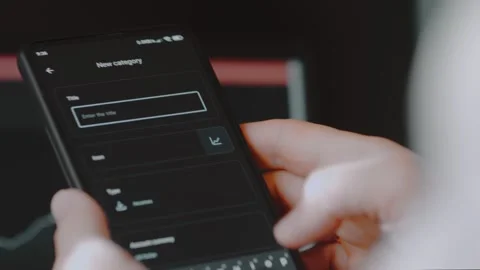 Smart money management. Using technology to track budget. A person who uses a Stock Footage 250383117
