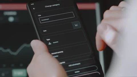 Smart money management. Using technology to track budget. A person who uses a Stock Footage 250383649