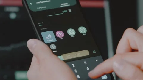 Smart money management. Using technology to track budget. A person who uses a Stock Footage 250384159