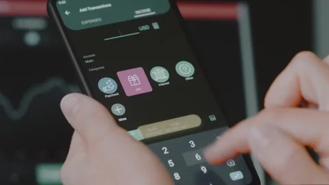 Smart money management. Using technology to track budget. A person who uses a Stock Footage 250384222