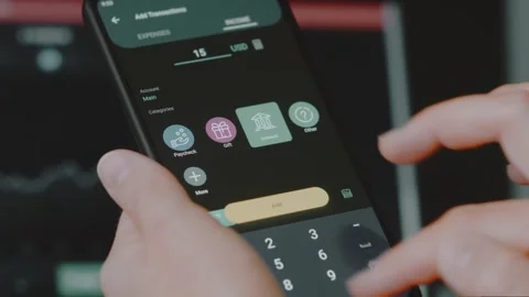 Smart money management. Using technology to track budget. A person who uses a Stock Footage 250384280