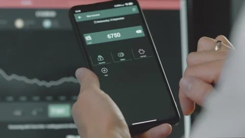 Smart money management. Using technology to track budget. A person who uses a Stock Footage 250384498