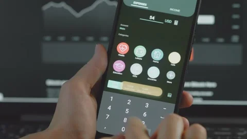 Smart money management. Using technology to track budget. A person who uses a Stock Footage 250386341