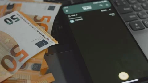 Smart money management. Using technology to track budget. A person who uses a Stock Footage 250387451