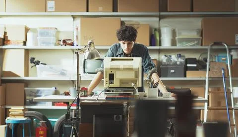 Smart nerd adolescent working with an old PC 스톡 사진