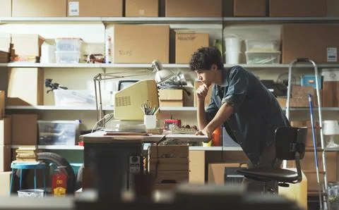 Smart nerd adolescent working with an old PC 스톡 사진