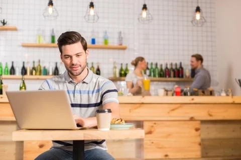 Smart nice man working on the laptop Stock Photos