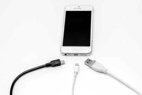 Smart phone and adapter cable Stock Photos