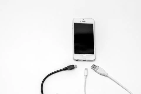 Smart phone and adapter cable Stock Photos