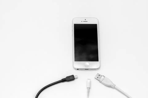 Smart phone and adapter cable Stock Photos
