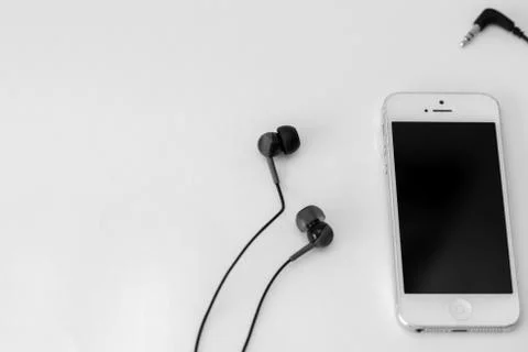 Smart phone and adapter cable Stock Photos