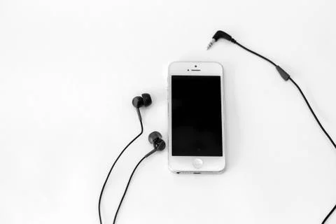 Smart phone and adapter cable Stock Photos