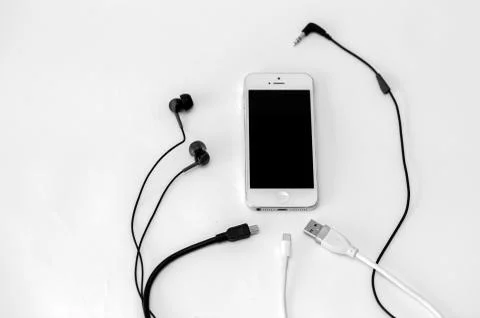 Smart phone and adapter cable Stock Photos