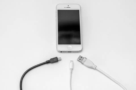 Smart phone and adapter cable Stock Photos