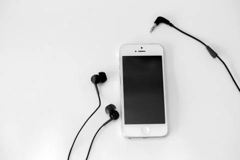 Smart phone and adapter cable Stock Photos