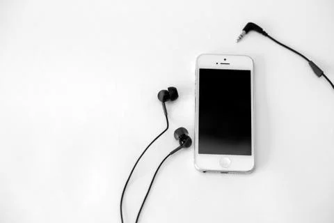 Smart phone and adapter cable Stock Photos