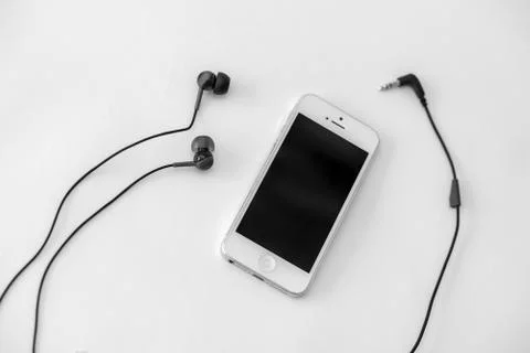 Smart phone and adapter cable Stock Photos