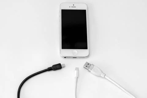 Smart phone and adapter cable Stock Photos