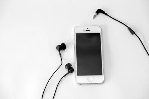 Smart phone and adapter cable Stock Photos