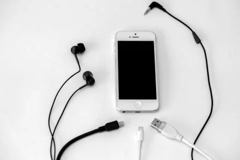 Smart phone and adapter cable Stock Photos