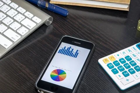 Smart phone and chart Stock Photos