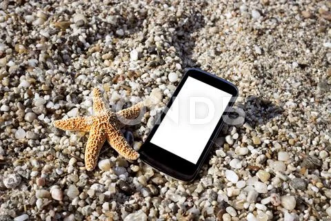 Smart Phone On Beach Close Up