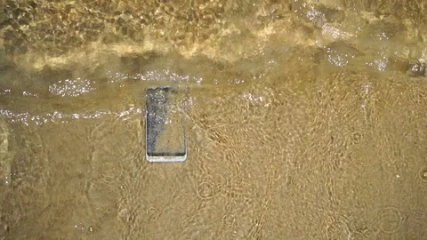 Smart phone on the beach Stock Footage 101342328