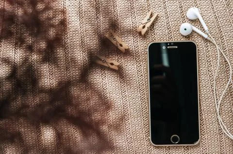 Smart phone with brown background Stock Photos
