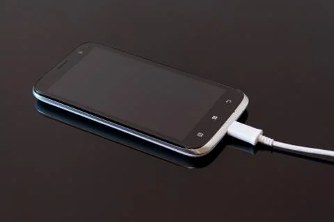 Smart Phone Charging with Cable Stock Photos