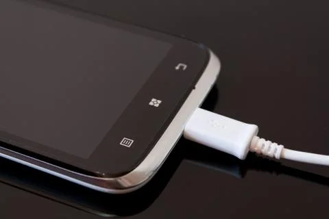 Smart Phone Charging with Cable Stock Photos