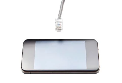Smart phone with data cable plug against white background Stock Photos