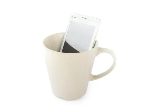Smart phone in empty mug on white background, Morning breakfast mic technolog Stock Photos