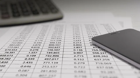 Smart Phone with Financial Data Animation On White Paper Stock Footage 123862517
